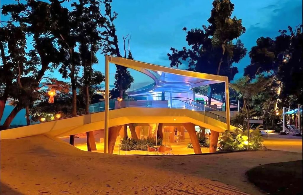 Tambuli Seaside Resort pavilion illuminated at night
