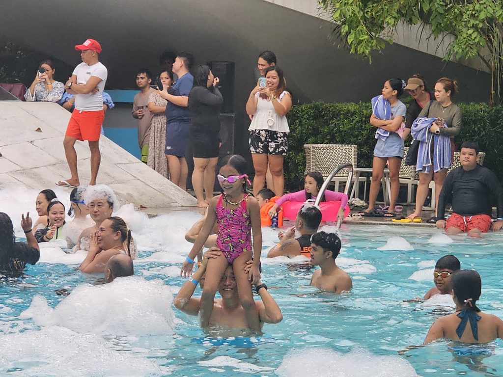 Family swimming at Tambuli Seaside Resort Cebu